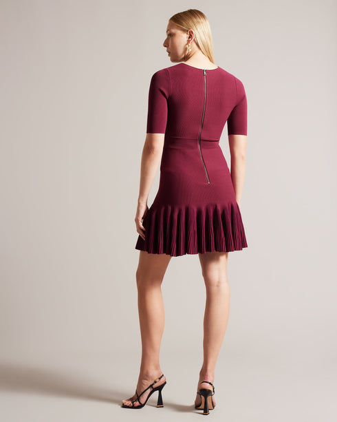 JOSAFEE-Dresses-When knitwear and glamour collide, you get JOSAFEE. This perfectly tailored mini dress boasts a figure hugging silhouette with a pleated hemline that ensures you'll look and feel fabulous in any setting, from a lunch date to a weekend exploring the city. Knitted mini dress Fit and flare silhouette Pleated hem Crew neck Half length sleeves Exposed zip fastening Ribbed waistband Jara is 5'10.5" / 1.79m and wears Dark Red in a Ted size 1 Feminine detailsA flirty pleated hem adds an interesting
